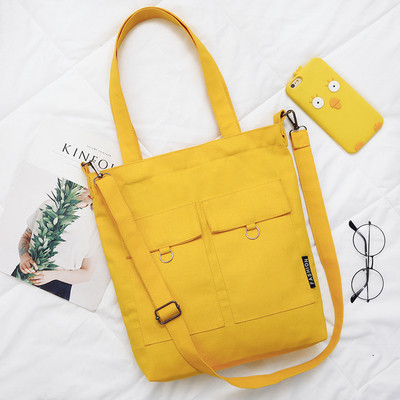 Дамска чанта тип торба с декоративни джобове в жълт, бял и черен цвят