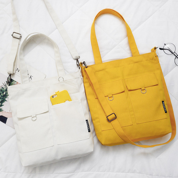 Geanta de dama tip geanta cu buzunare decorative in galben, alb si negru