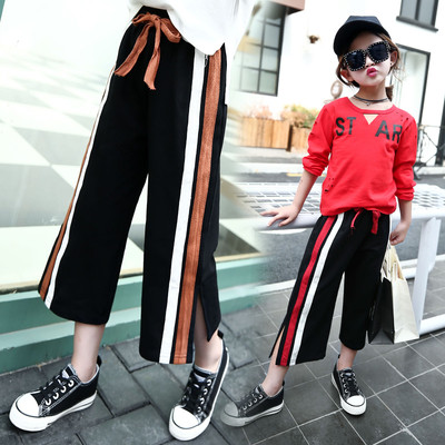 Модерен детски панталон  за момичета в свободен стил с висока талия,цепка и цветен кант,два модела
