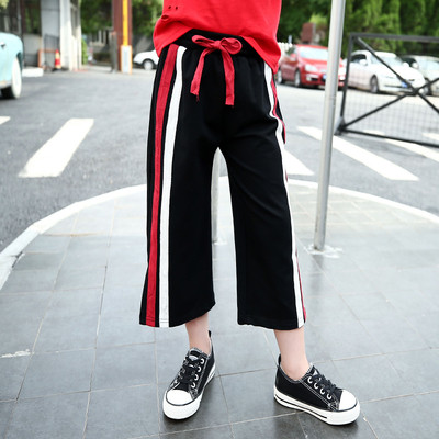 Pantaloni copii moderni pentru fete in stil liber cu talie inalta, cu fanta si margini colorate, doua modele