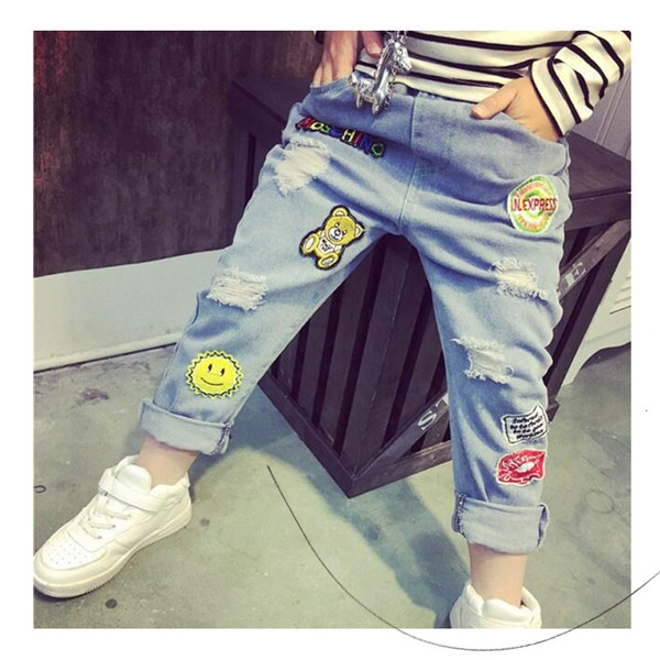 Blugi unisex moderni pentru copii cu mini imprimeuri color și petice în culori deschise