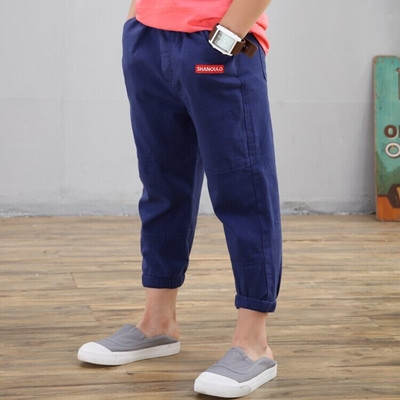 Pantaloni eleganti pentru copii in trei culori cu buzunare si imprimeu