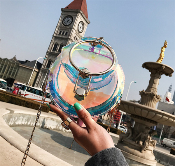 Geanta de dama casual transparenta in forma rotunda cu maner metalic