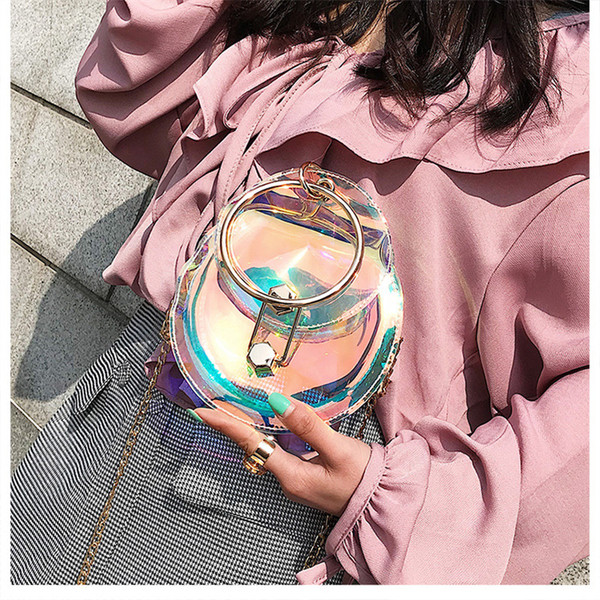 Geanta de dama casual transparenta in forma rotunda cu maner metalic
