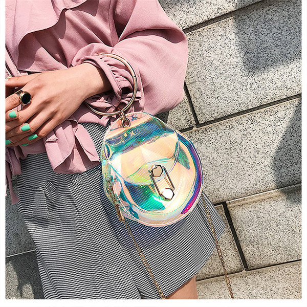 Geanta de dama casual transparenta in forma rotunda cu maner metalic