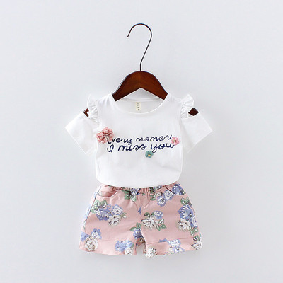 Модерен детски комплект за момичета  от две части-тениска с апликация и надпис и панталон с флорален мотив в два цвята