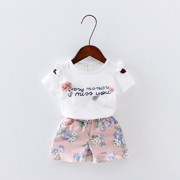 Set pentru copii modern pentru fete din două părți - tricou cu aplicație și inscripție și pantaloni cu motiv floral în două culori