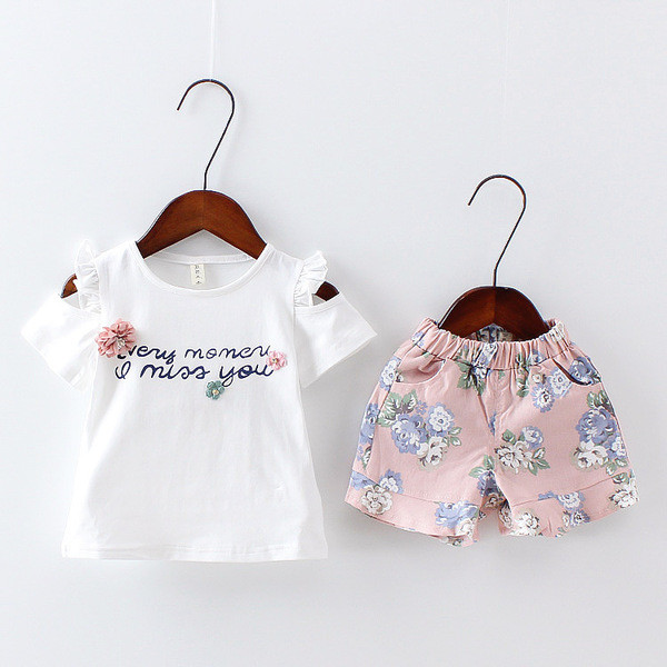 Set pentru copii modern pentru fete din două părți - tricou cu aplicație și inscripție și pantaloni cu motiv floral în două culori