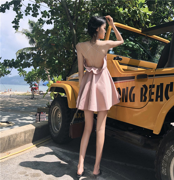 Дамска рокля разкроена с гол гръб с кръстосани връзки в розов цвят