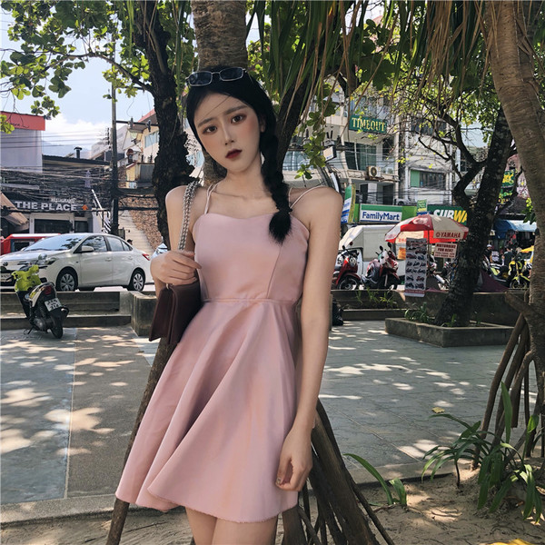 Дамска рокля разкроена с гол гръб с кръстосани връзки в розов цвят