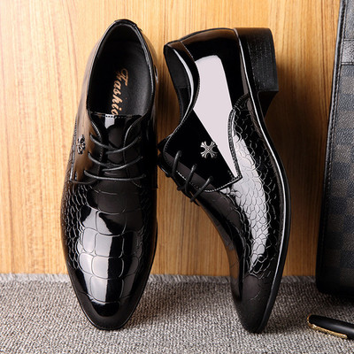 Formal patent leather men`s shoes with metal decoration