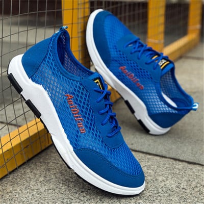 Summer men`s sneakers with laces and an inscription in several colors