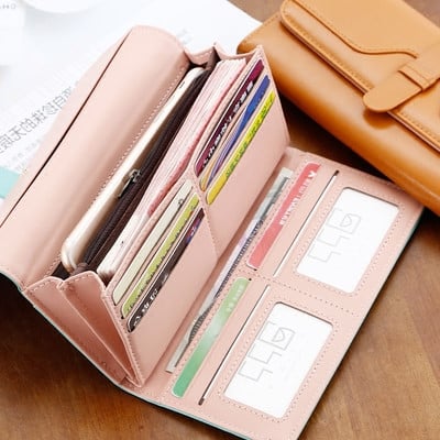 Women`s long wallet made of eco leather in different colors with metal decoration and inscription