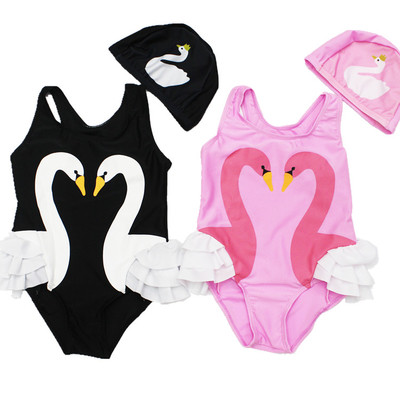 Stylish full children`s swimsuit for girls in pink and black with a print