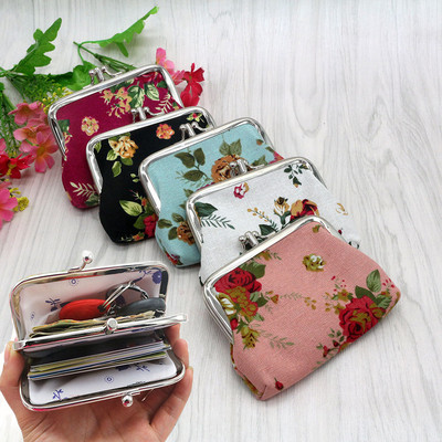 Women`s small wallet made of fabric in floral pattern