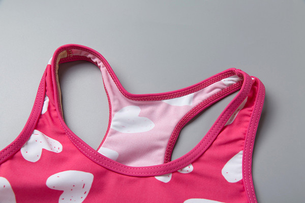 Costum de baie pentru fete pentru copii din două părți - maiou și chiloți roz cu imprimeu