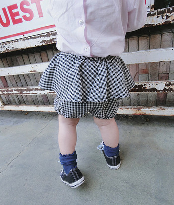 Μοντέρνα παιδικί φούστα για τα κορίτσια σε δύο χρώματα - μαύρο και καρό