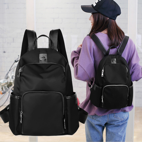 Rucsac sport de damă cu buzunare laterale în negru și albastru