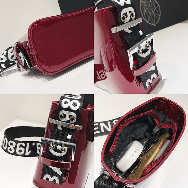 Női lakktáska széles pánttal, különböző színekben, felirattal