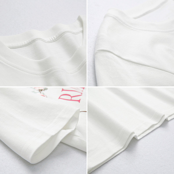 Fehér női póló hímzett virágokkal