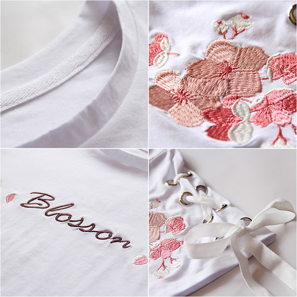 Fehér női blúz virágos motívumokkal