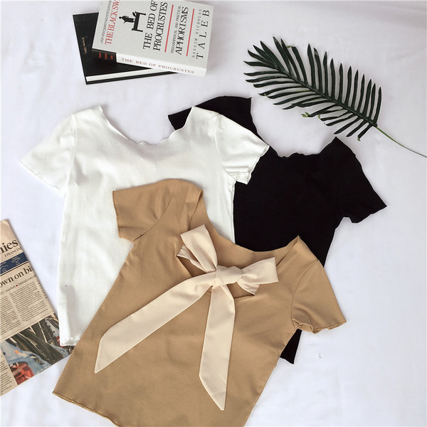 Női póló nyitott háttal és szalagos elemmel