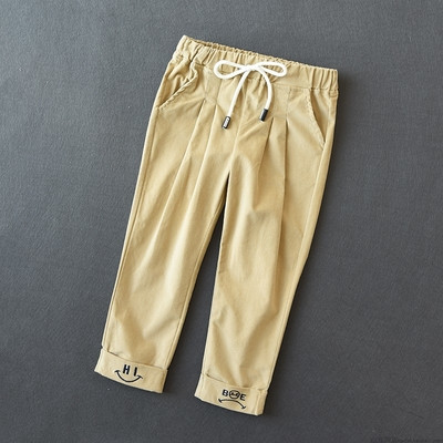 Elasztikus derékkal és több színben hímzéssel ellátott gyereknadrág lányoknak és fiúknak egyaránt