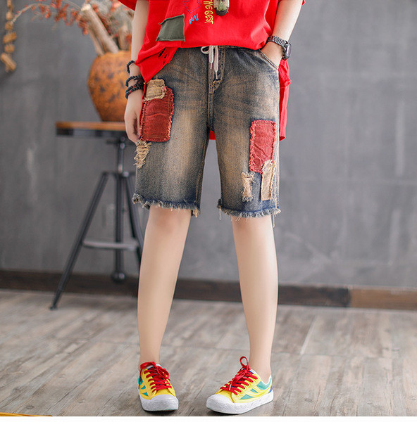 Γυναικεία  3/4 φαρδιά τζιν με σχισμένα στοιχεία