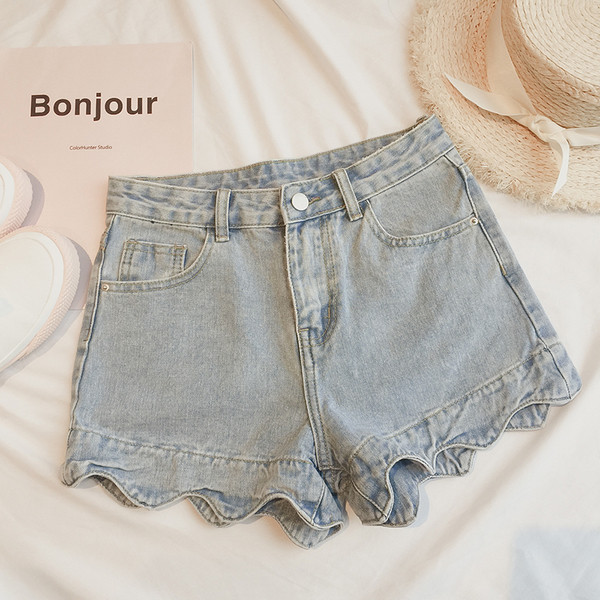 Női farmer rövidnadrág fürtökkel