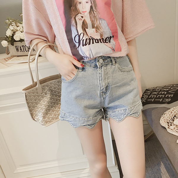 Női farmer rövidnadrág fürtökkel