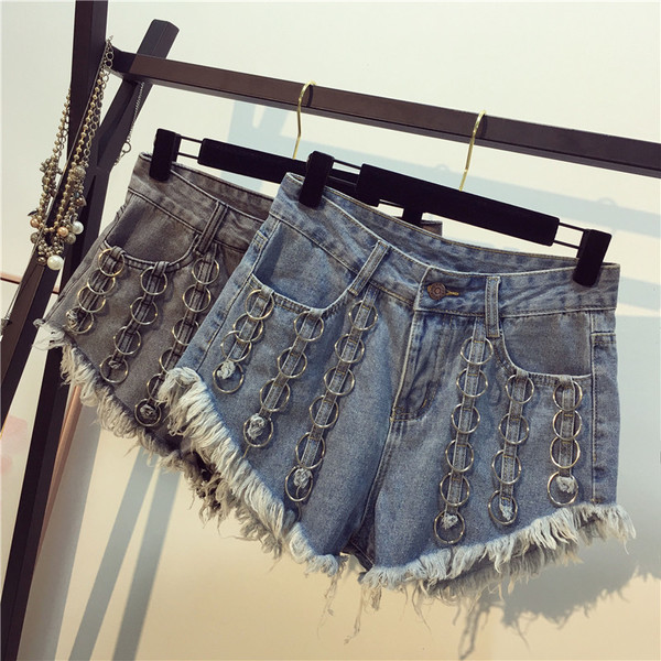 Fém körökkel díszített női farmer rojtos farmernadrág két színben