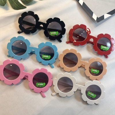 An interesting model of children`s sunglasses for girls in several colors