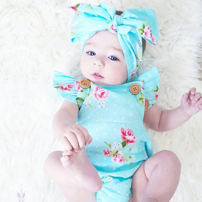 Children`s summer body in floral pattern with ruffles