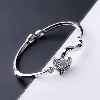 Γυναικείο βραχιόλι σε δύο χρώματα με διακοσμητικές πέτρες