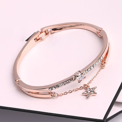 Women`s bracelet in different models with pendants and decorative stones