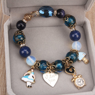 Women`s bracelet with beads and metal pendants in three colors