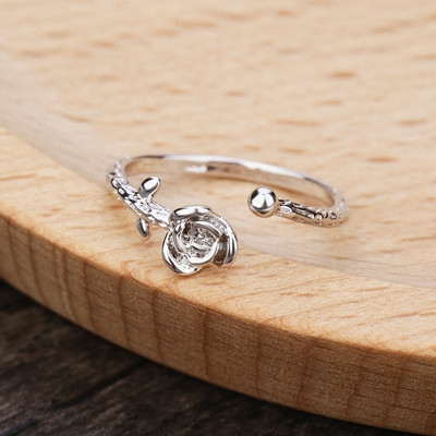 Delicate thin lady`s ring in the shape of a rose