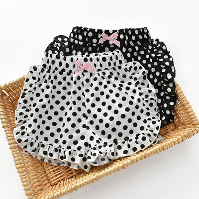 Children`s shorts for girls with a dotted ribbon