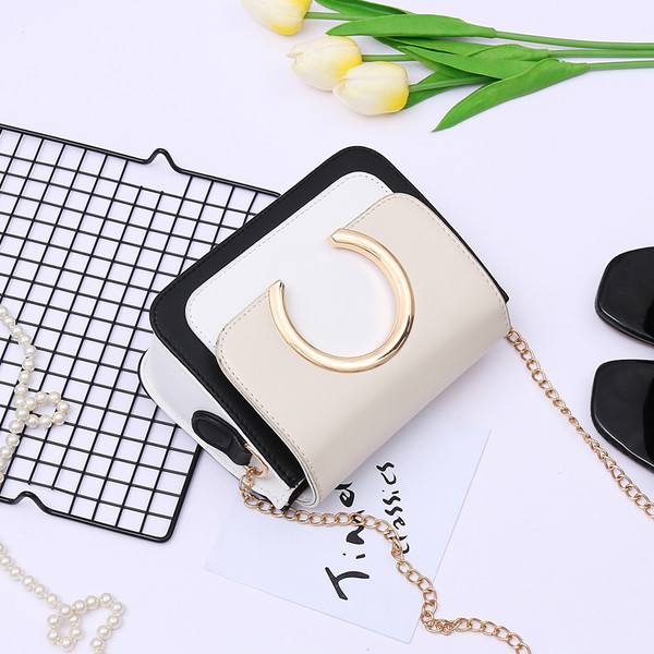 Stílusos mini kézitáska fém díszítéssel több színben