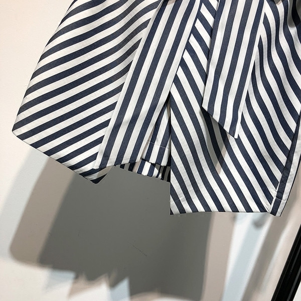 Fusta de damă în dungi, elegantă, cu curea și lungime asimetrică