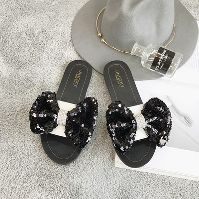 Γυναικείες παντόφλες με επίπεδη σόλα με κορδέλες πούλιες σε διαφορετικά χρώματα