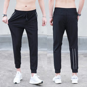 Καλοκαιρινή αθλητική γυναικεία  φόρμα σε μαύρο χρώμα με λευκές λωρίδες