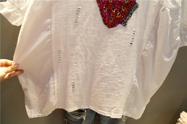 Tunica de dama marimea MAXI alb cu aplicatie si maneci 3/4 intr-un model larg