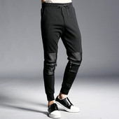 Ανδρική ασπρόμαυρη αθλητικήφόρμα με στοιχεία από οικολογικό δέρμα και μεταλλικά στοιχεία