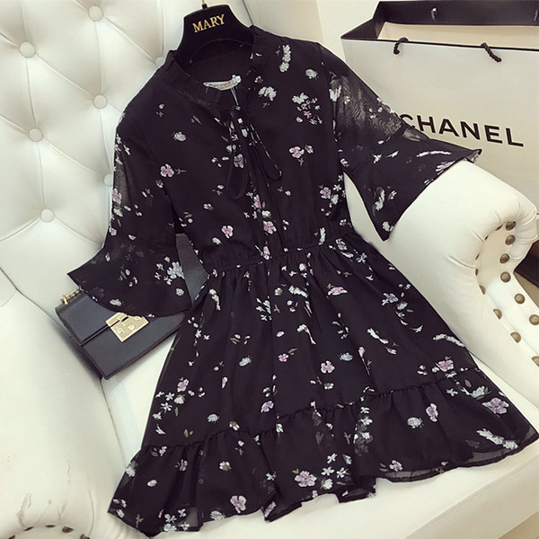 Κομψό γυναικείο φόρεμα σε ροζ και μαύρο χρώμα με floral μοτίβα