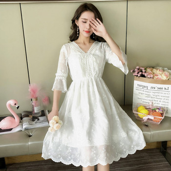 Κομψό γυναικείο φόρεμα με ντεκολτέ σε σχήμα V σε μαύρο και άσπρο