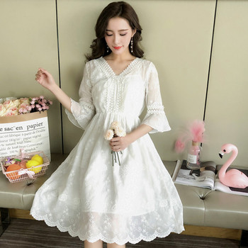 Κομψό γυναικείο φόρεμα με ντεκολτέ σε σχήμα V σε μαύρο και άσπρο