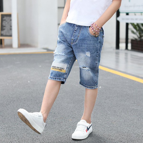 Blugi pentru copii cu motive rupte, petice și inscripție