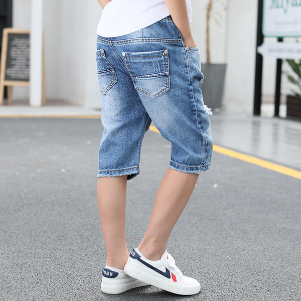 Blugi pentru copii cu motive rupte, petice și inscripție