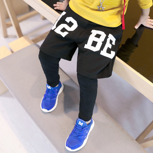 Pantaloni lungi moderni pentru copii cu imitație de pantaloni scurți în două culori cu inscripție